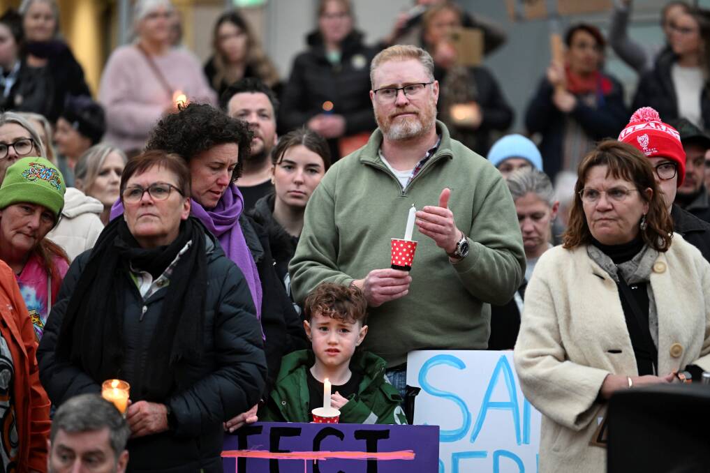 Faces in the crowd at the rally against gendered violence in Lydiard Street. Picture by Lachlan Bence
