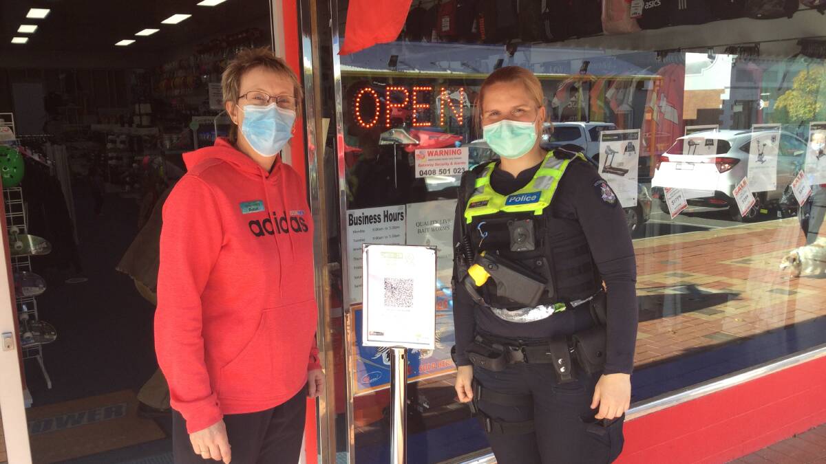 SCANNING IN: Stawell Sportspower Robyn Young with First Constable Lauren Cole checking into the shop. Picture: CONTRIBUTED