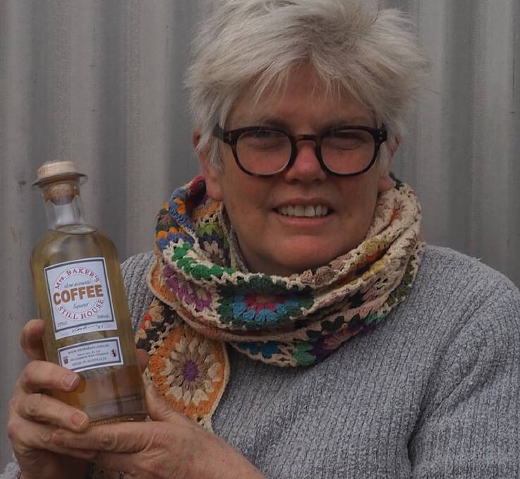 WINNER: Jane Baker with a bottle of the coffee liqueur. Picture: CONTRIBUTED