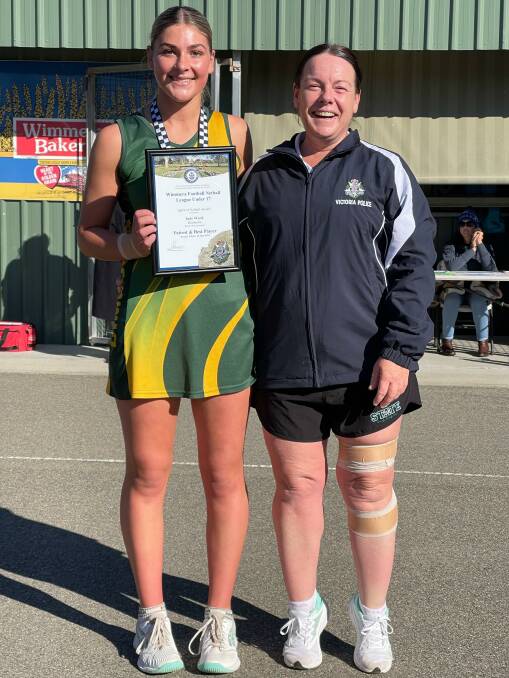 Dimboola's Indy Ward receives her Blue Ribbon Foundation Spirit of Netball award from Warracknabeal police officer Leading Senior Constable club coach Anna Lake. Picture supplied