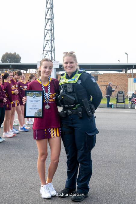 Warrack's Lauren Clyne receives her Blue Ribbon Foundation Spirit of Netball award from Warracknabeal police officer Senior Constable Laura Cole. Picture supplied