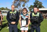 Taylors Lake Swifts under-17s footballer Lachie Kenyon receives his Blue Ribbon Spirit of Football award from Stawell police officers Sergeant Richard Jane and First Constable Nathan Byrne. Picture supplied