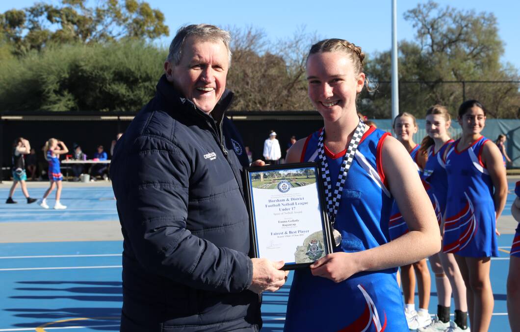 Rupanyup's Emma Gellatly receives her Blue Ribbon Foundation Spirit of Netball award from foundation member Les Power. Picture supplied