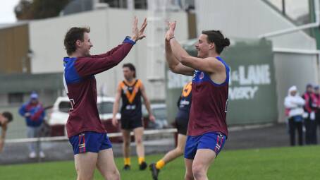 Jordan Motton celebrates with Brody Pop after the first goal of the round 14 WFNL match against Nhill at City Oval on Saturday, July 27. Picture by Lucas Holmes
