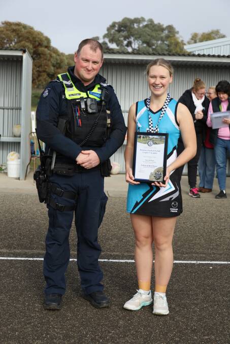Southern Mallee's Taya Horsham receives her Blue Ribbon Foundation Spirit of Netball award from Jeparit police officer Senior Constable Aari Mellington. Picture supplied