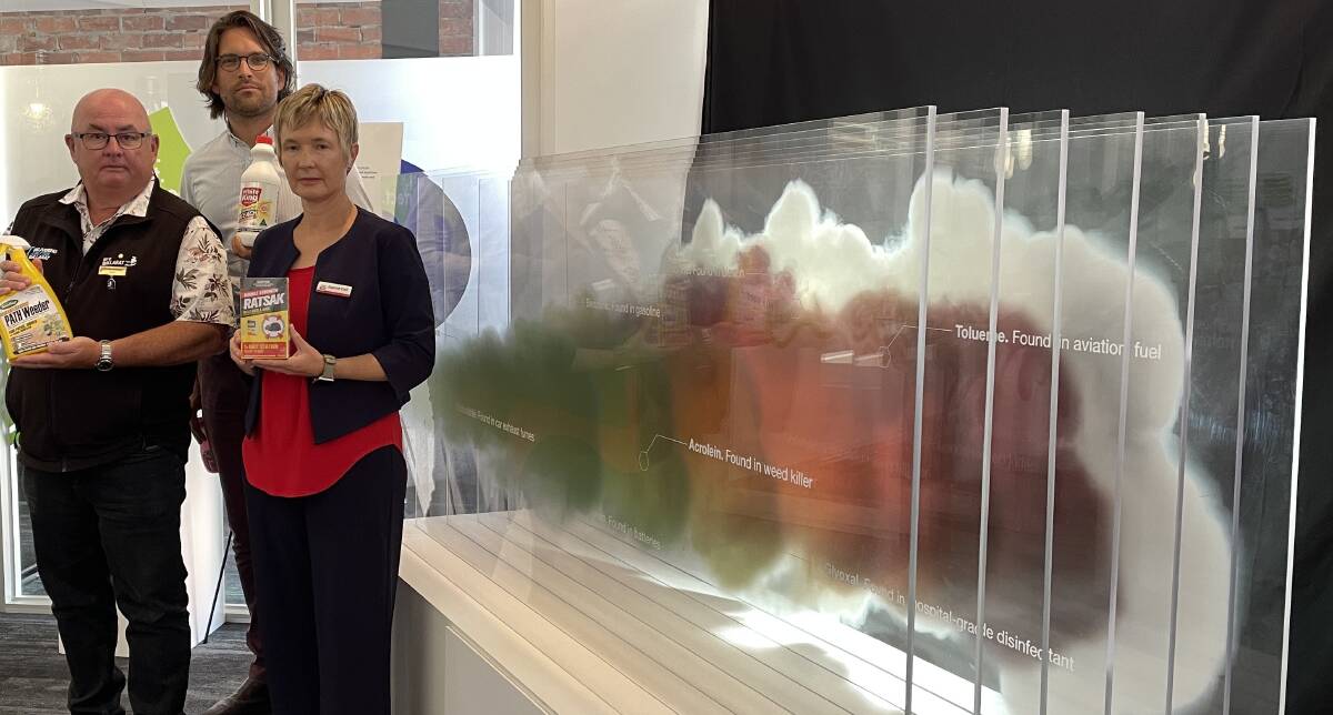 City of Ballarat mayor Des Hudson , VicHealth chief executive Sandro Demaio and Ballarat Community Health client services executive manager Joanne Gell take a closer look at poisons promoted in vaping products, as highlighted in the vape cloud.
