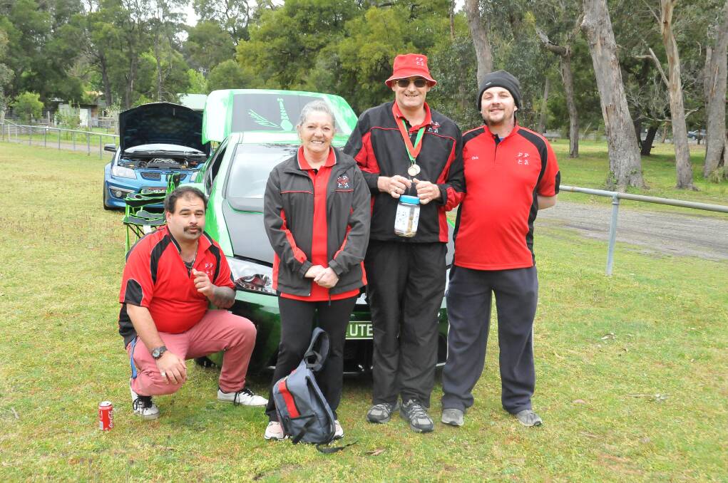 DAY OUT: Jake, support worker Loretta Miller, Bernie and Chris attended the Halls Gap Show and Shine show on Sunday to raise money for Ararat Braves. Picture: CASSANDRA LANGLEY