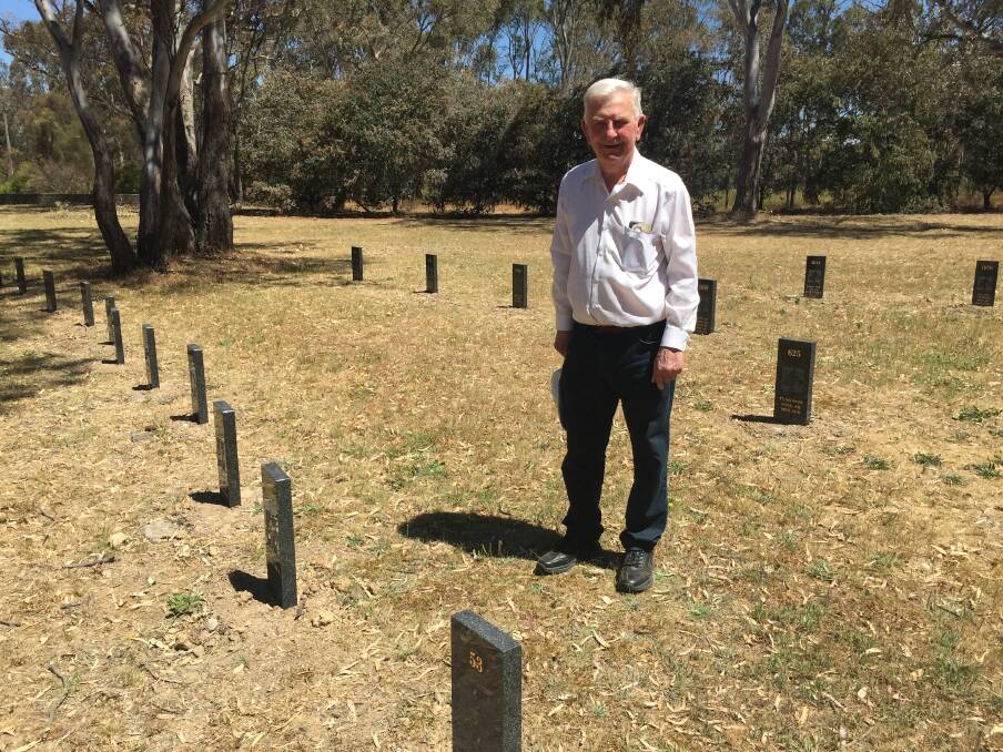 HISTORY RESURRECTED: Henry Gunstone with the tombstones marking the graves of Ararat's Chinese pioneers. Picture: JESSIEANNE GARTLAN. 
