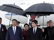 China's Xi Jinping (left) welcomed by French Prime Minister Gabriel Attal (right) in Paris. (AP PHOTO)